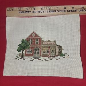 Cross-stitch village. Handmade, just needs a frame